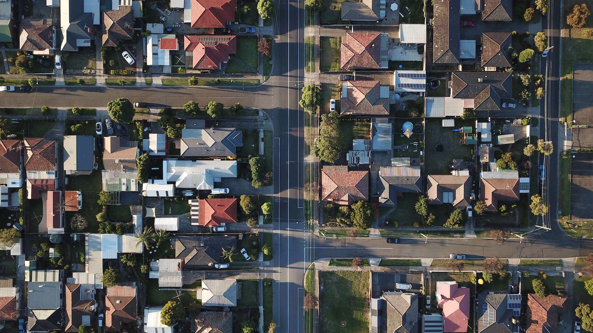 Aerial view of houses // Tom Rumble / unsplash.com